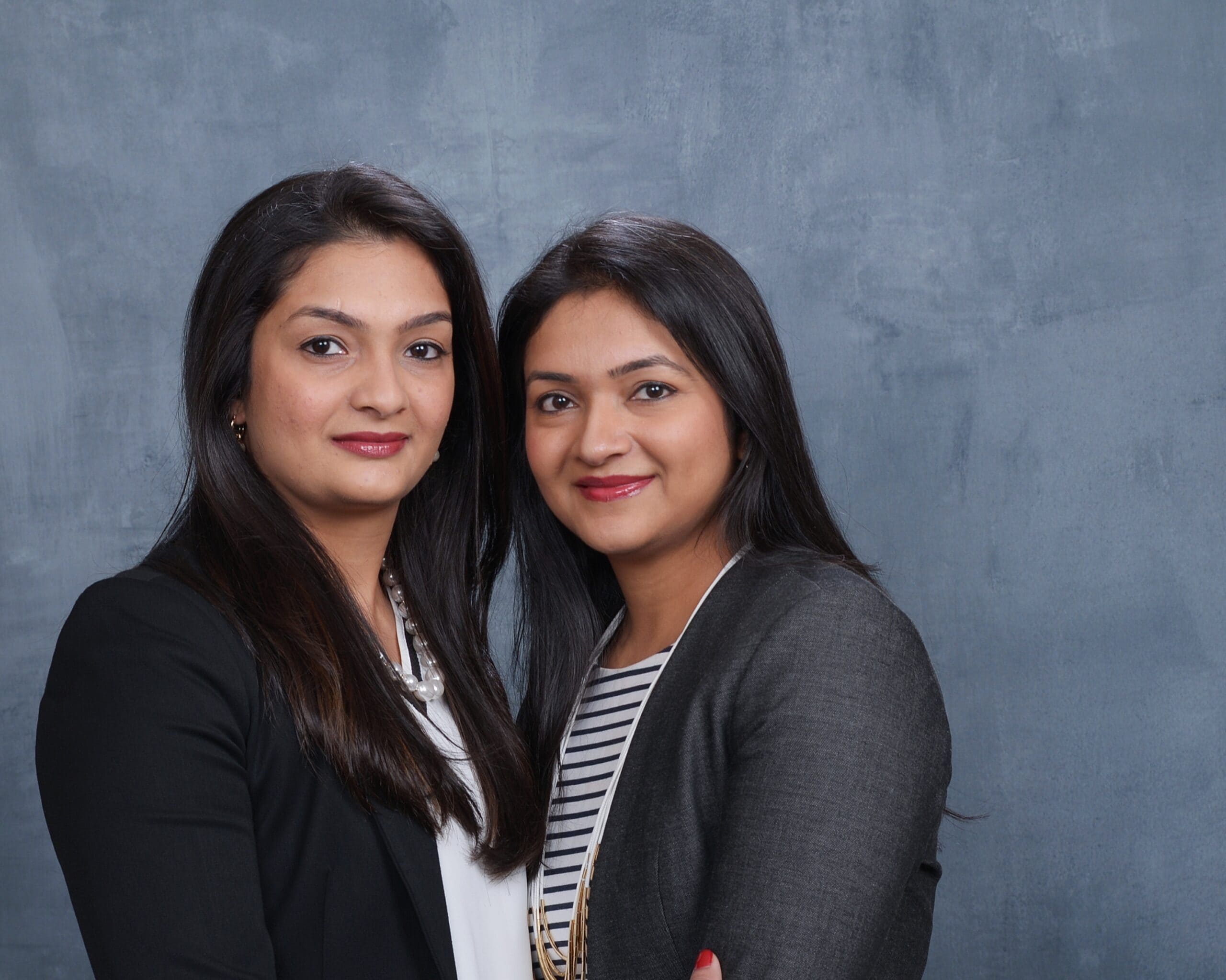 Photo of two sisters in professional attire