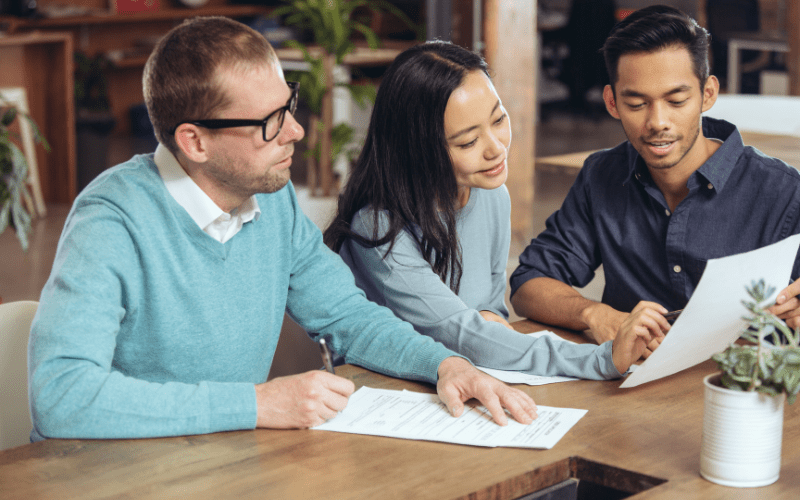 A group of young professionals discussing tax structure.